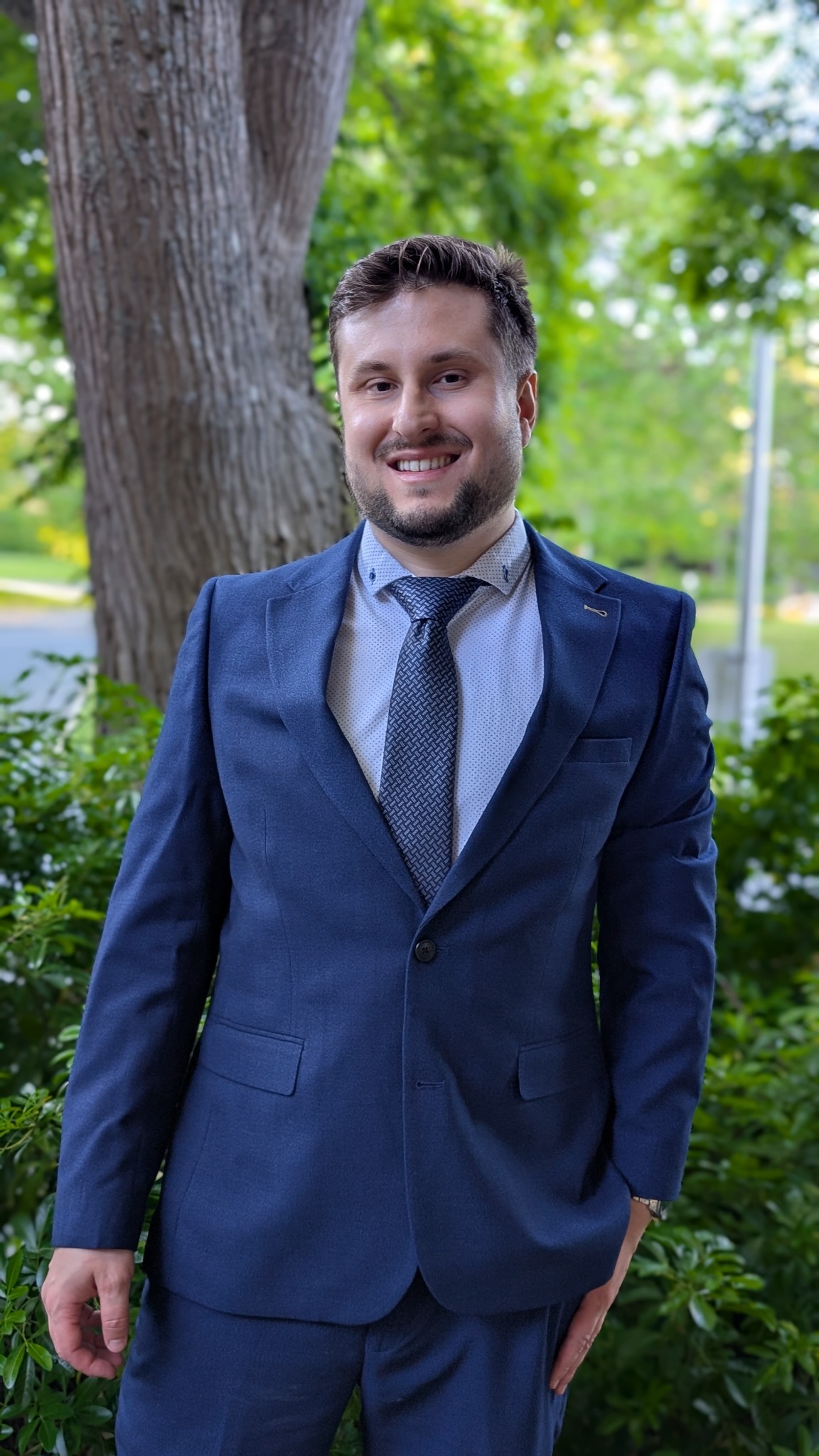 Lucas Steglich in business attire outdoors